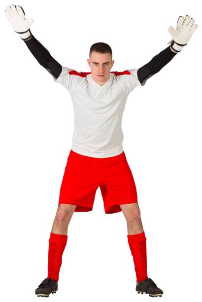 istock Goalkeeper in red and white ready to catch 834264442