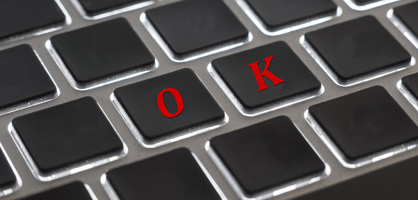 The red letter of OK on computer keyboard background for design in your Presentation