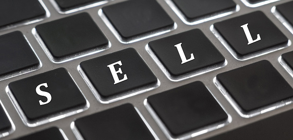 The white letter of Sell on computer keyboard background for design in your Presentation