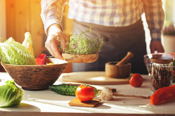 istock male cooking healthy salad 834276632