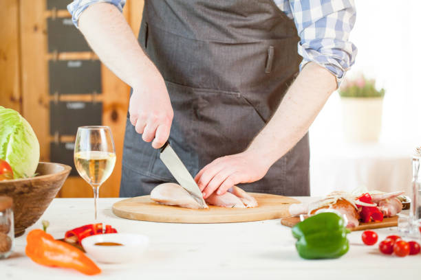 istock male preparing chicken for cooking 834277618