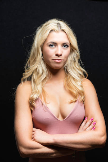 istock Blue-eyed blond wearing a pink top 834292250