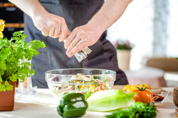 istock Chef cutting fresh and delicious vegetables for salad 834292436