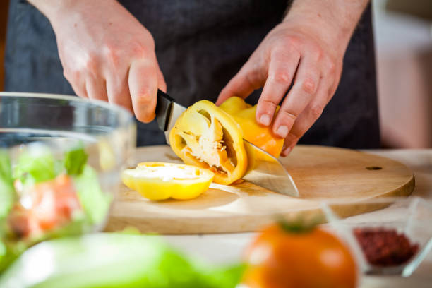 istock Chef cutting fresh and delicious vegetables for salad 834292886