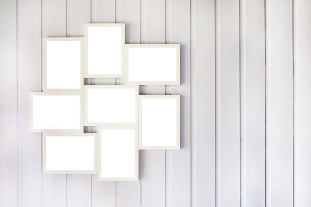 Blank photo frame collage on the wooden wall, interior layout