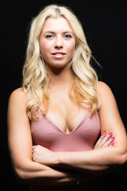 istock Blue-eyed blond wearing a pink top 834297762