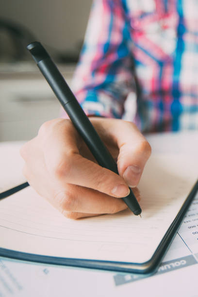 istock Business Person Working on Laptop and Making Notes 834298156