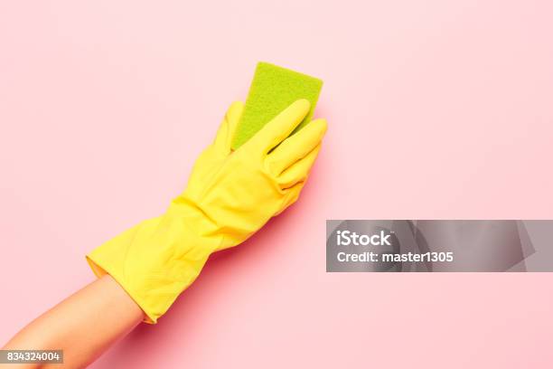 The Womans Hand Cleaning On A Pink Background Cleaning Or Housekeeping Concept Stock Photo - Download Image Now