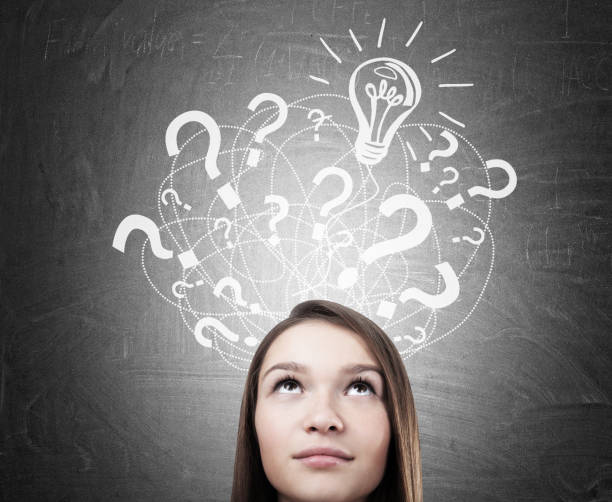 istock Teen girl s head, question marks, light bulb 834329984