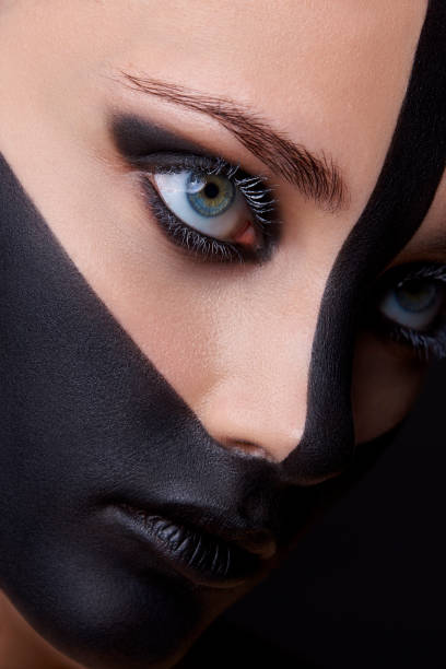 Close Up Beauty Portrait Of Woman Face With Black Paint Stock Photo -  Download Image Now - iStock