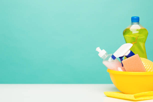 istock Various bottles with cleaning supplies on colored background 834337494