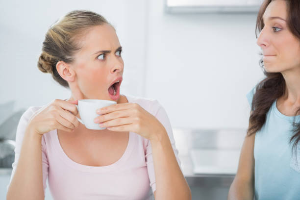 istock Dazed blonde looking at her friend 834337870
