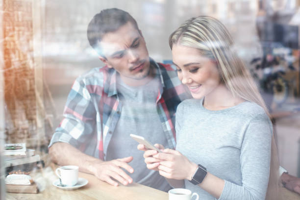 istock Nice looking man and woman in cafe 834364766