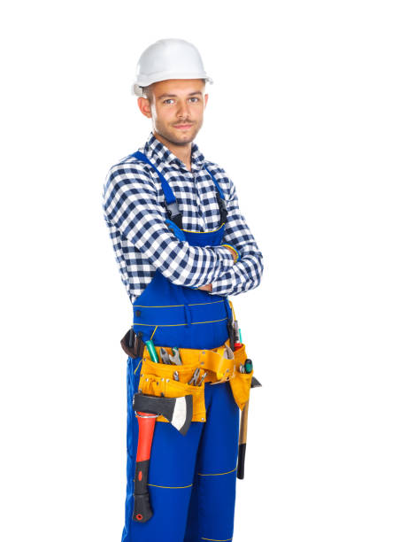 istock Young confident construction worker in uniform and tool belt with crossed arms 834367754