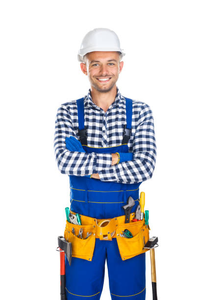 istock Happy smiling construction worker in uniform and tool belt with crossed arms 834367776