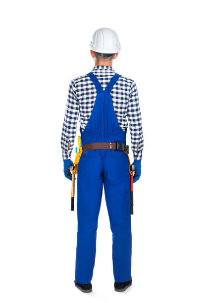 istock Back view of young construction worker in uniform and tool belt 834367804