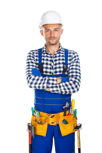 istock Young confident construction worker in uniform and tool belt with crossed arms 834367806