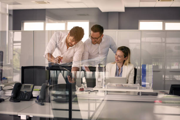 istock Three colleague in office reading document. Business people in office. 834375944