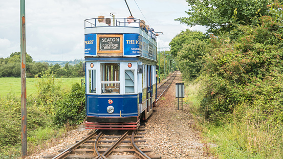 Detail of the Seaton Tramway electrified transport system linking Colyton to Seaton. A popular tourist destination. Passengers sit on the tram.