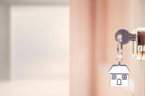 istock House key in the door 834398170