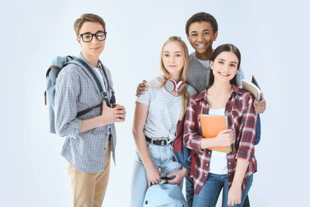 istock multiethnic group of teenagers with backpacks looking at camera isolated on white 834399848