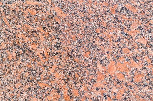 istock Pattern of red colorful granite, closeup. Background. 834427672
