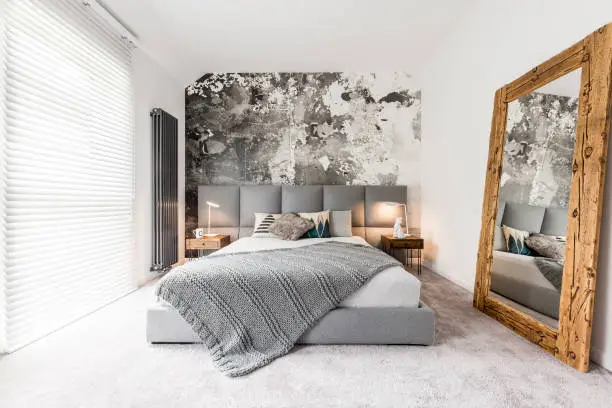 Photo of Bedroom with large wooden mirror