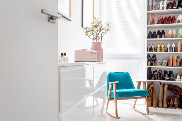 istock Elegant closet with blue armchair 834429446