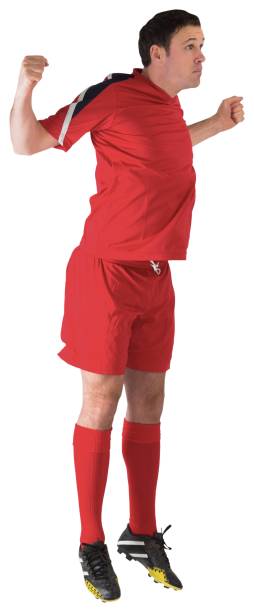 istock Football player in red jumping 834436028