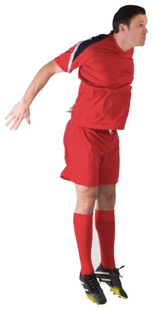 istock Football player in red jumping 834436094