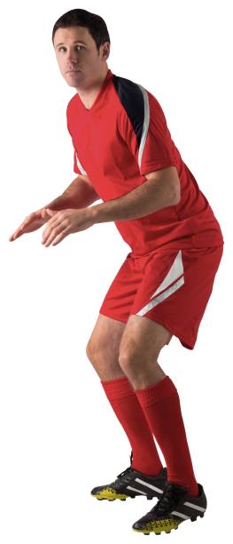 istock Football player in red standing ready 834437098