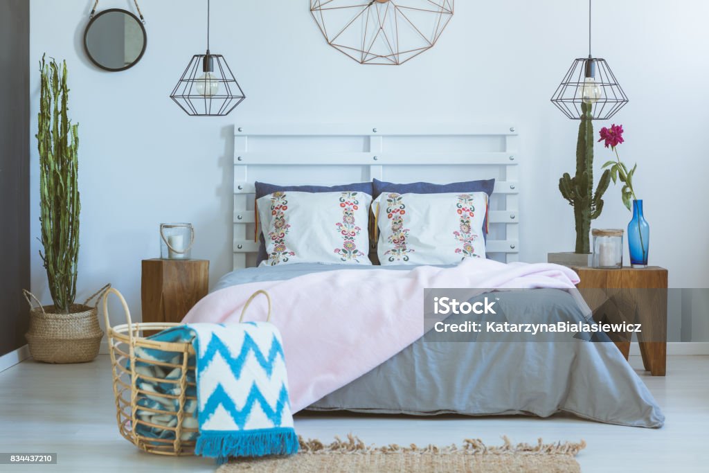 Bedroom, mixed materials and colors Bedroom with mix of natural materials, patterns and pastel colors Apartment Stock Photo