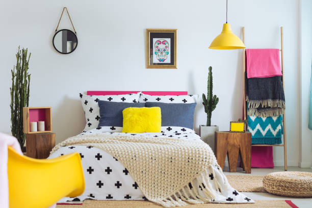 Festive bedroom of folk lover Festive bedroom of folk lover, mix of styles and materials colourful mexican houses stock pictures, royalty-free photos & images