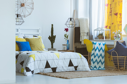 Unique bedroom inspiration, yellow pop of color and trendy accessories