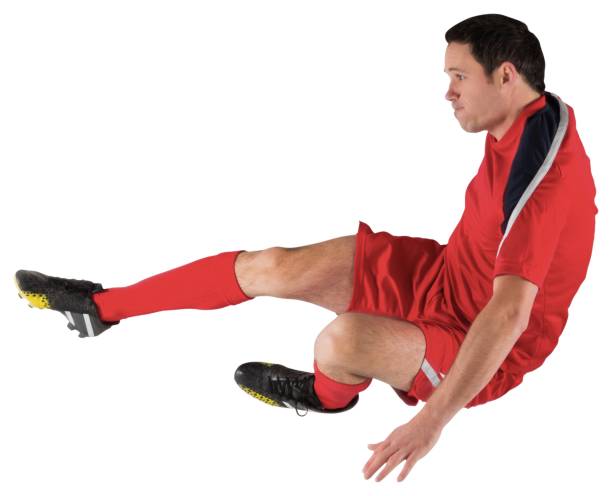 istock Football player in red kicking 834437764