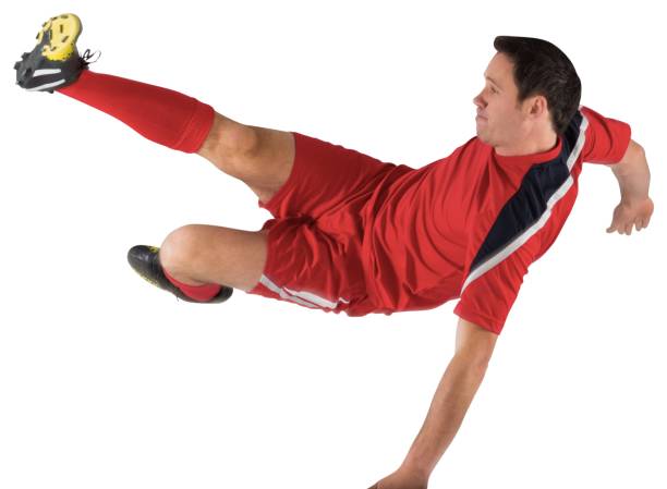 istock Football player in red kicking 834437920