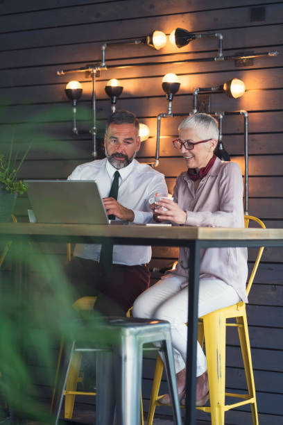 istock Mature business people at cafe 834447752