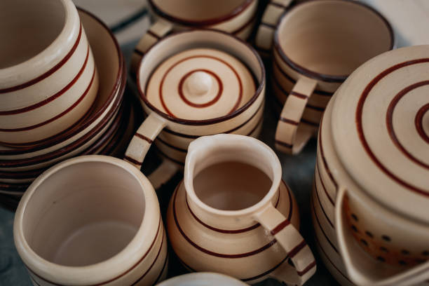 istock Handcrafted pottery set of dishes, handmade Utensils background, view from above 834454468