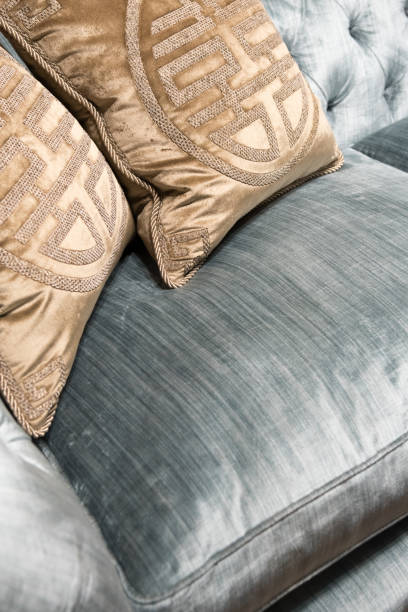 istock Luxurious Gold Cushions on Expensive Blue Sofa 834460774