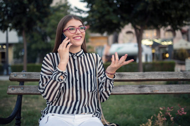 istock Young woman talking on a phone 834465814