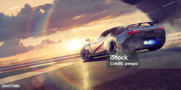 Sports Car Drifting Round Racetrack Bend At Sunset Stock Photo - Download Image Now - Sports Car, Car, Racecar