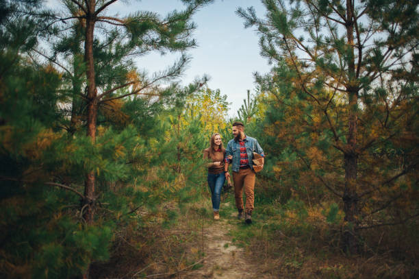 istock Beautiful young couple in a pine forest 834491888
