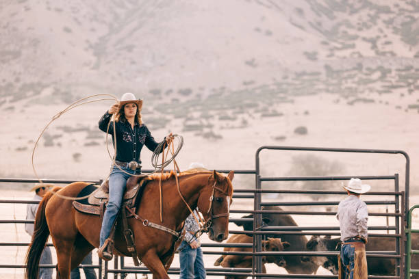istock riding cowgirl 834494188