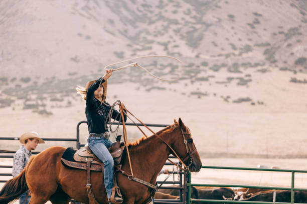 istock riding cowgirl 834494196