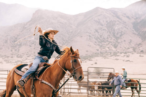 istock riding cowgirl 834494202