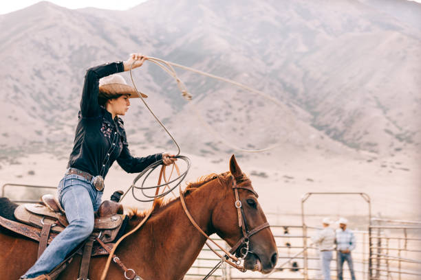 istock riding cowgirl 834494284