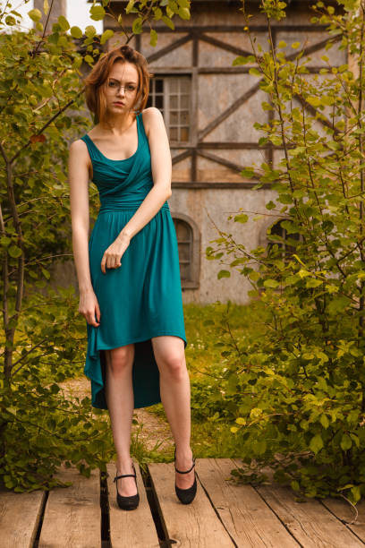 istock Pretty young women posing on wooden platform in castle 834516538