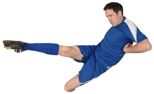 istock Football player in blue kicking 834524936