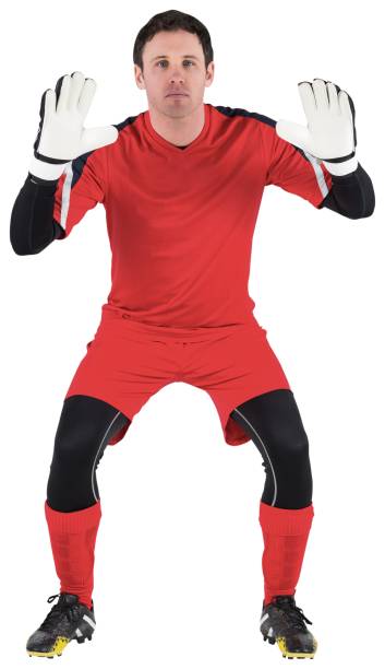 istock Goalkeeper in red ready to catch 834527546