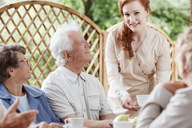 istock Friendly nurse meets with patients 834528808